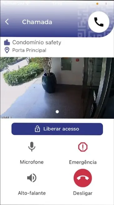 Tela de chamada do app Safety Home Portaria com a imagem da câmera, botão Liberar acesso, microfone, alto-falante e desligar
